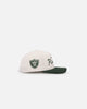 New Era Las Vegas Raiders 'Currency Corduroy' Golfer Pre-Curved Snapback Chrome White