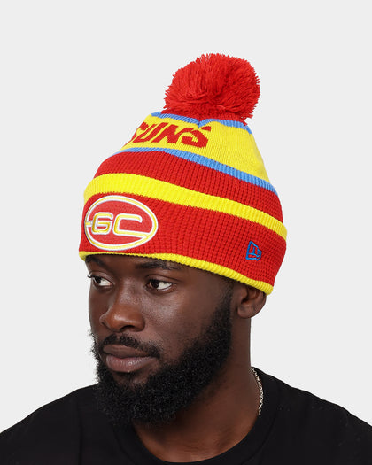 New Era Gold Coast Suns AFL Opening Bounce 2022 Pom Waffle Wordmark Beanie Red/Yellow