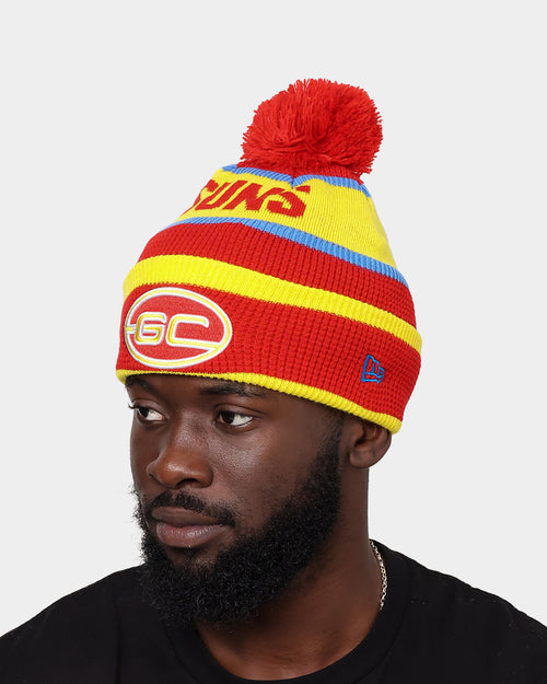 New Era Gold Coast Suns AFL Opening Bounce 2022 Pom Waffle Wordmark Beanie Red/Yellow